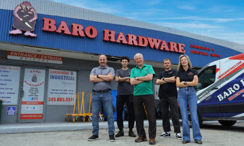 Baro Hardware staff in front of their store with a Baro van parked next to them